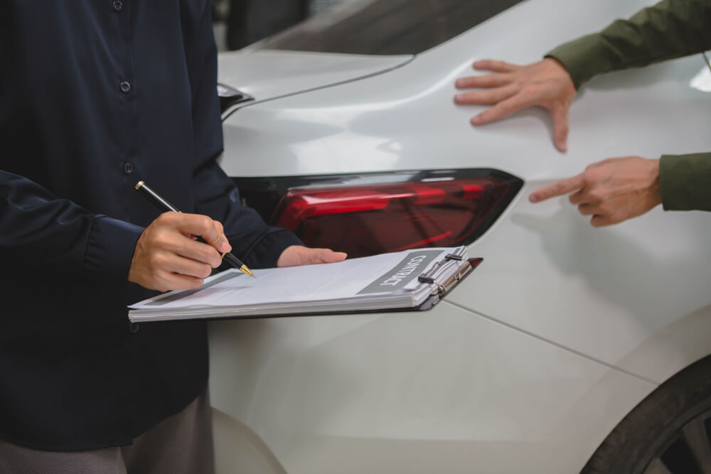 Insurance Adjuster taking notes